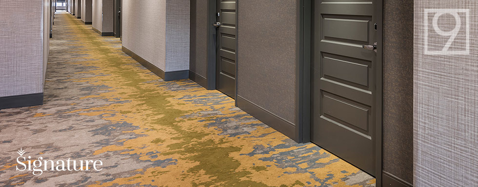 Hotel hallway showing Signature carpet broadloom installation.